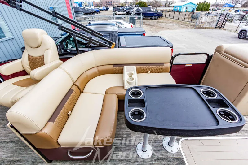 Slide: The Image of 2023 Godfrey Sweetwater 2286 FS pontoon boat with luxurious seating and table setup. - 22