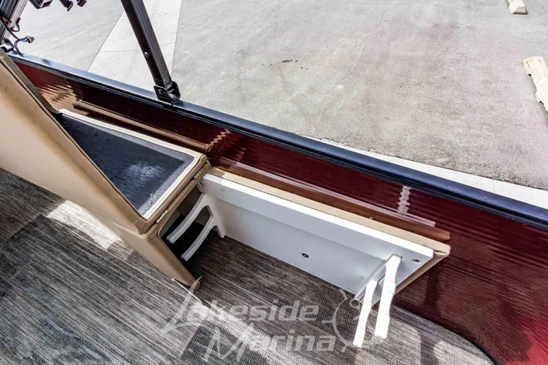 Slide: The Image of 2023 Godfrey Sweetwater 2286 FS boat interior with seating and flooring details. - 25