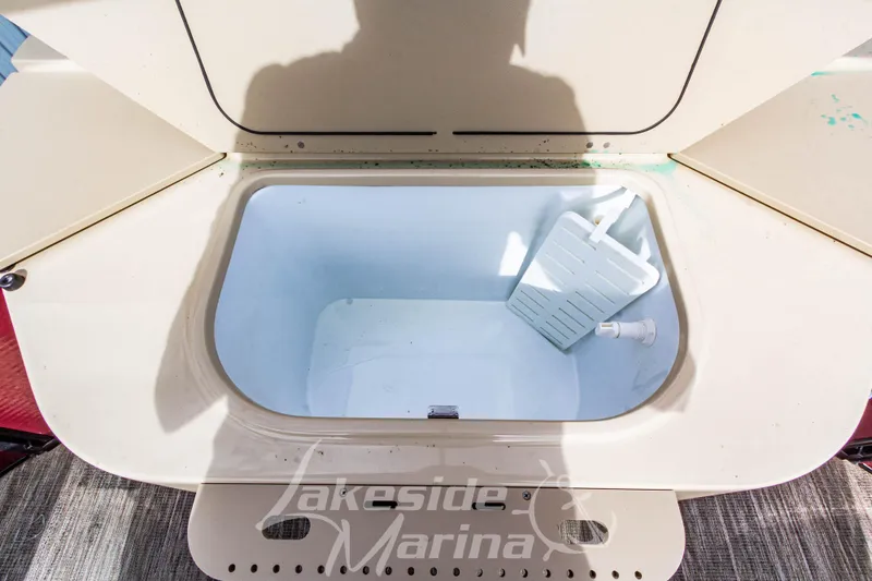 Slide: The Image of Open storage compartment on 2023 Godfrey Sweetwater 2286 FS boat at Lakeside Marina. - 28