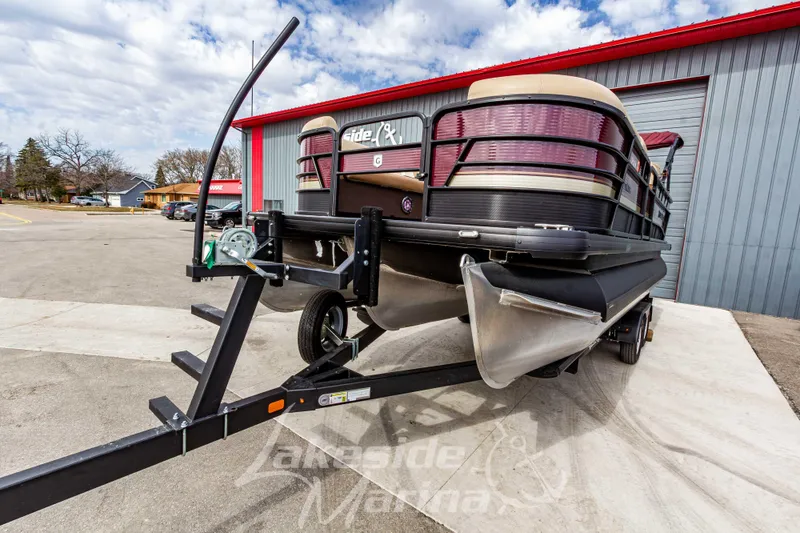 Slide: The Image of 2023 Godfrey Sweetwater 2286 FS pontoon boat on trailer at marina. - 7