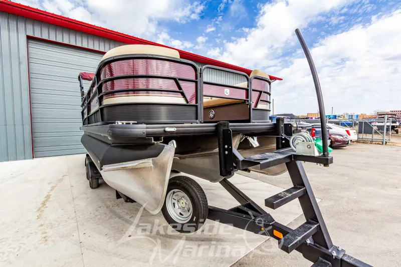 Slide: The Image of 2023 Godfrey Sweetwater 2286 FS pontoon boat on trailer at marina. - 8
