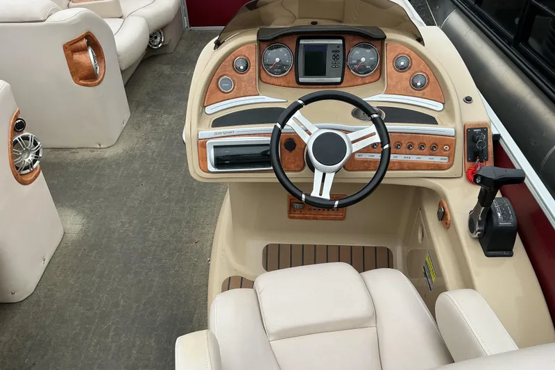 Slide: The Image of 2013 Godfrey Sanpan SP2200 BC3 boat interior with steering wheel and control panel. - 10
