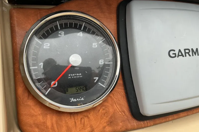 Slide: The Image of Tachometer and Garmin device on 2013 Godfrey Sanpan SP2200 BC3 dashboard. - 13