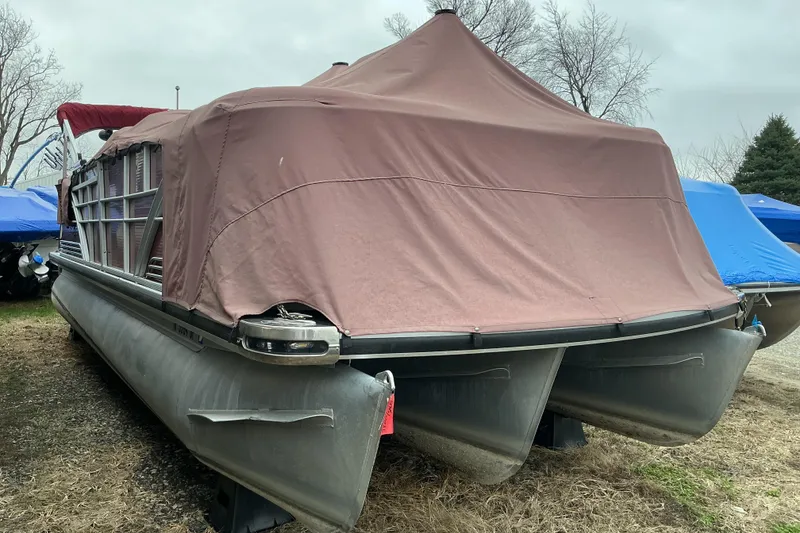 Slide: The Image of 2013 Godfrey Sanpan SP2200 BC3 pontoon boat covered with a brown tarp. - 17