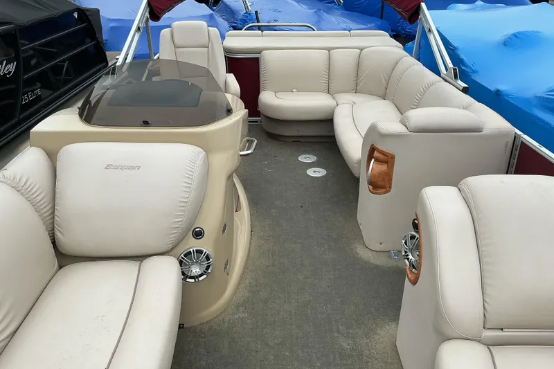 Slide: The Image of 2013 Godfrey Sanpan SP2200 BC3 pontoon boat with beige seating and modern interior design. - 9