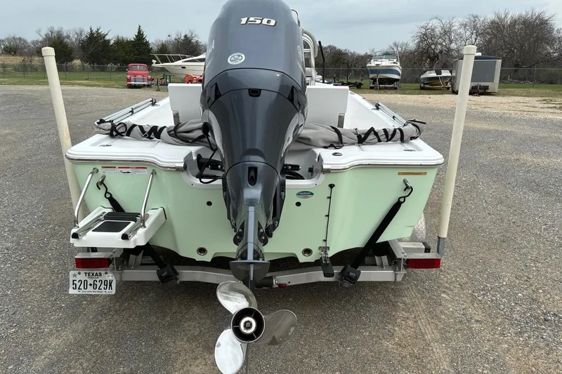 Slide: The Image of 2020 Sportsman Tournament 214 SBX Bay Boat with Yamaha 150 engine, rear view. - 4