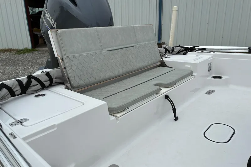 Slide: The Image of 2020 Sportsman Tournament 214 SBX Bay Boat with cushioned seating and Yamaha engine. - 5