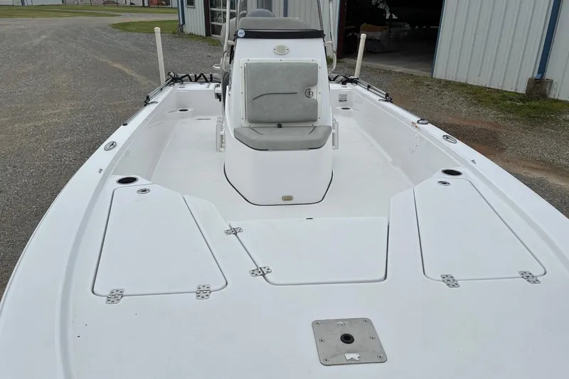 Slide: The Image of 2020 Sportsman Tournament 214 SBX Bay Boat, spacious deck, white finish, outdoor setting. - 9