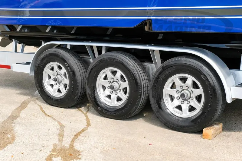 Slide: The Image of Triple-axle trailer supporting a 2023 Nor-Tech 390 Sport Center Console boat. - 102