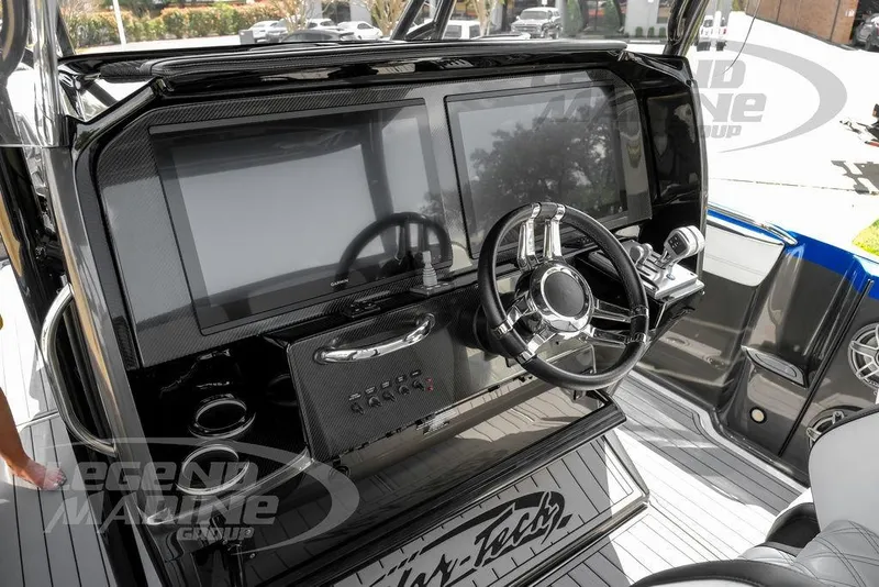 Slide: The Image of 2023 Nor-Tech 390 Sport Center Console dashboard with modern steering and navigation displays. - 13