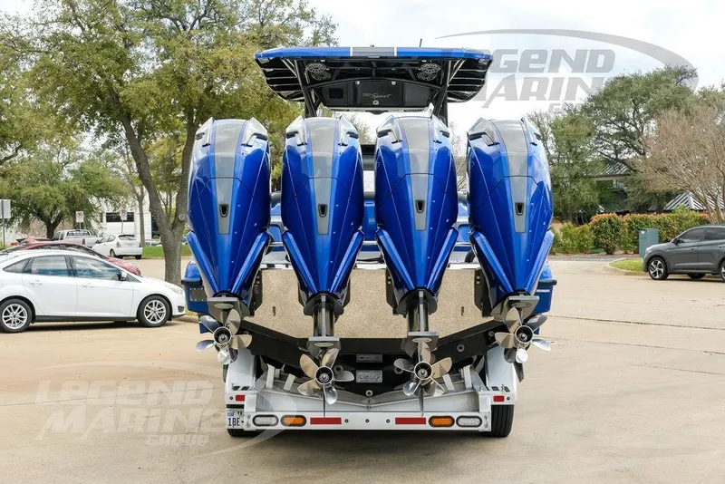 Slide: The Image of 2023 Nor-Tech 390 Sport Center Console boat with quad engines on a trailer. - 14