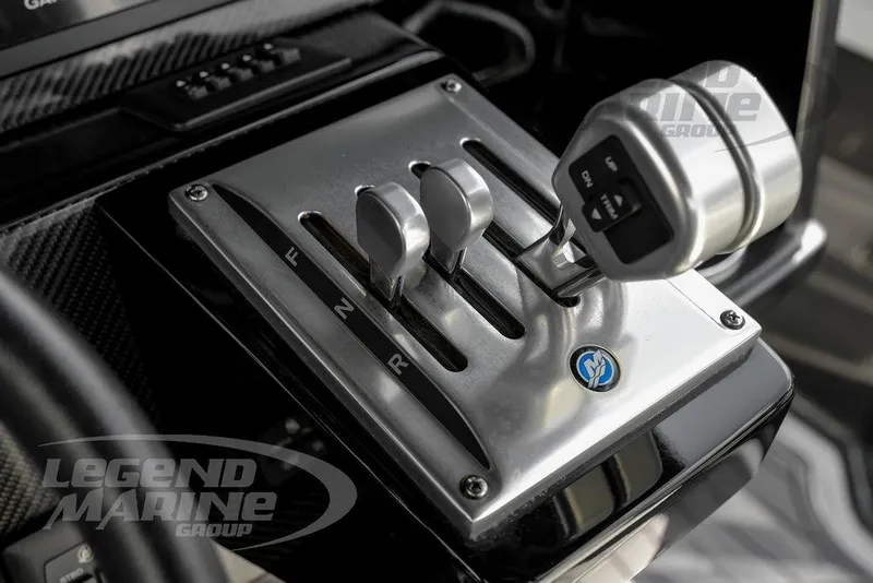 Slide: The Image of Throttle controls of a 2023 Nor-Tech 390 Sport Center Console boat. - 18