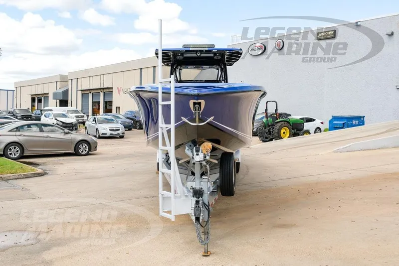Slide: The Image of 2023 Nor-Tech 390 Sport Center Console boat on trailer at dealership. - 3