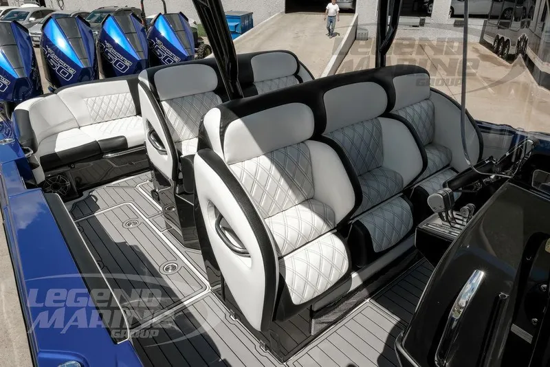 Slide: The Image of 2023 Nor-Tech 390 Sport Center Console interior with diamond-stitched seating and sleek design. - 37