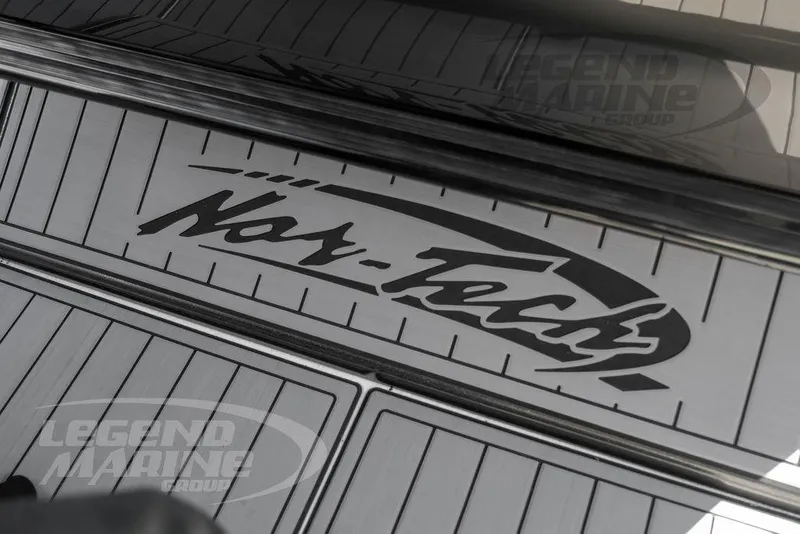 Slide: The Image of Open storage compartment on 2023 Nor-Tech 390 Sport Center Console boat deck. - 39