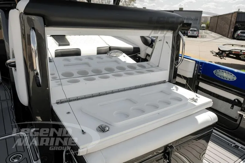 Slide: The Image of 2023 Nor-Tech 390 Sport Center Console with open storage compartment on deck. - 40