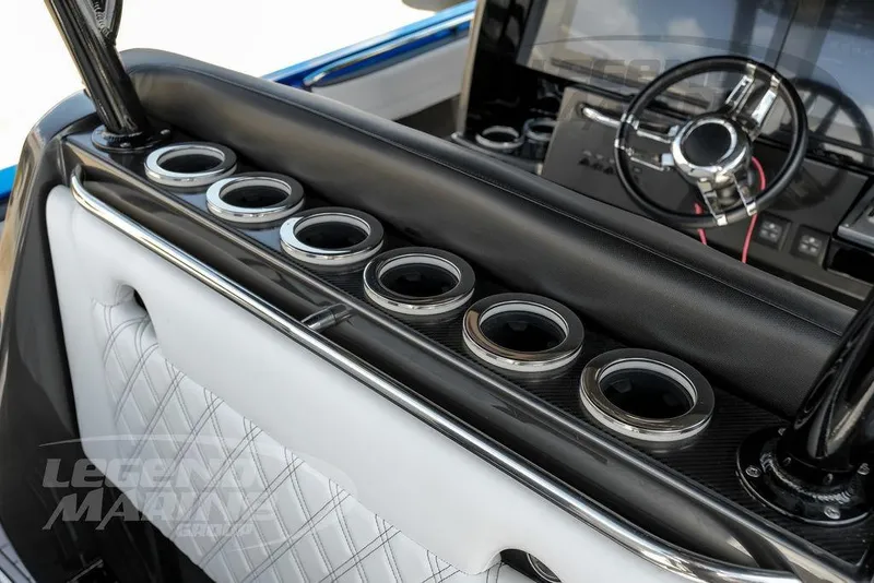 Slide: The Image of 2023 Nor-Tech 390 Sport Center Console interior with stylish seating and storage. - 44