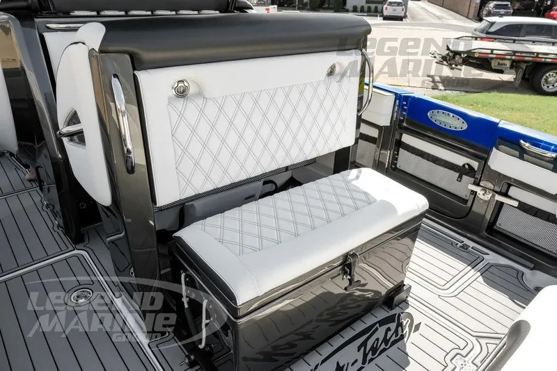 Slide: The Image of 2023 Nor-Tech 390 Sport Center Console with open storage compartments and sleek design. - 45