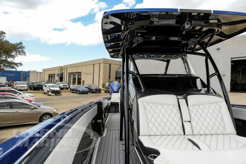 Slide: The Image of 2023 Nor-Tech 390 Sport Center Console with luxurious seating and powerful engines. - 53