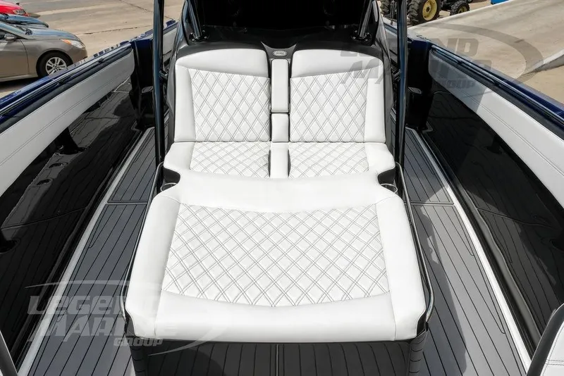 Slide: The Image of 2023 Nor-Tech 390 Sport Center Console with luxurious white diamond-stitched seating. - 58