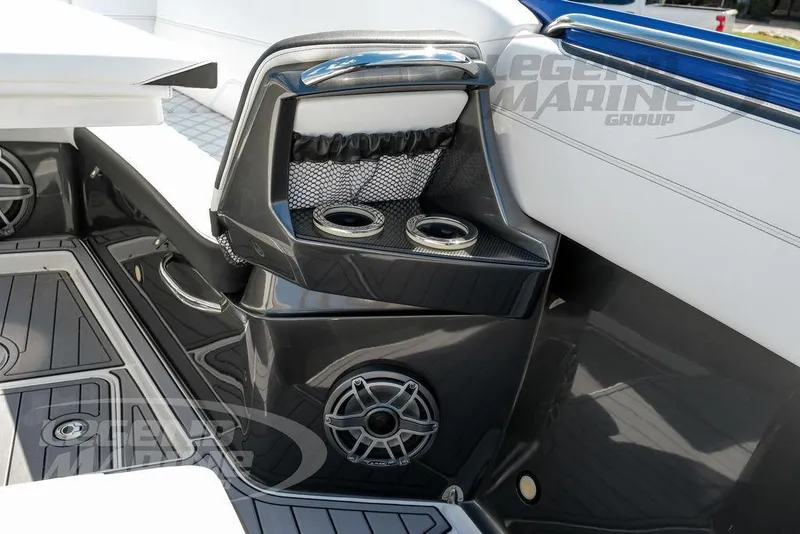 Slide: The Image of 2023 Nor-Tech 390 Sport Center Console interior with cup holders and speaker system. - 60