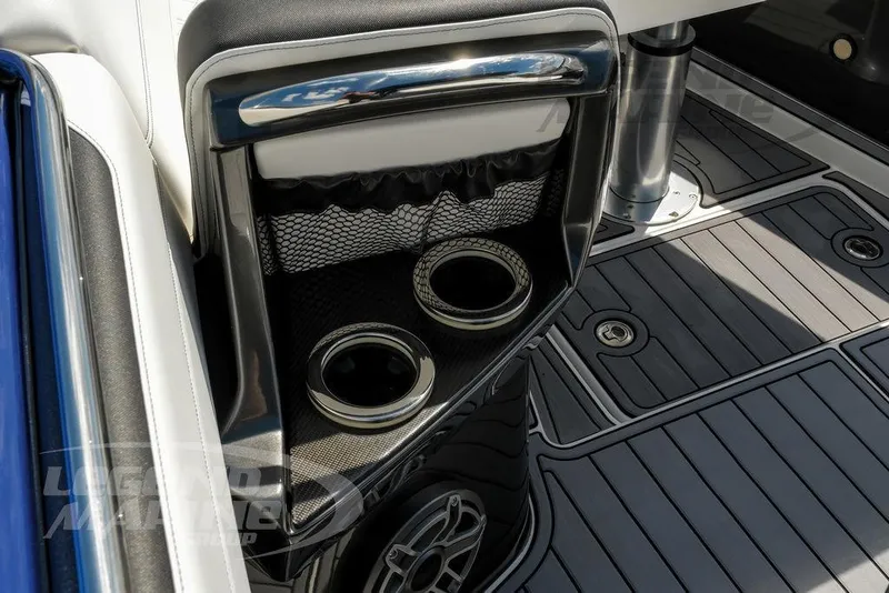 Slide: The Image of 2023 Nor-Tech 390 Sport Center Console interior with cup holders and sleek flooring. - 64
