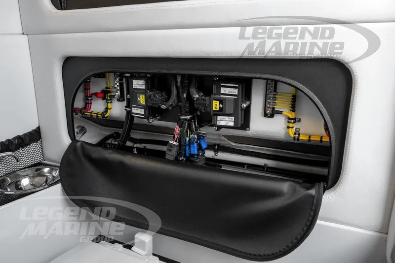 Slide: The Image of 2023 Nor-Tech 390 Sport Center Console boat interior with toilet and fire extinguisher. - 78
