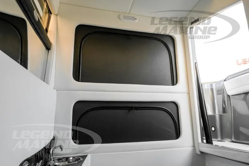 Slide: The Image of JL Audio speaker on 2023 Nor-Tech 390 Sport Center Console boat interior. - 81