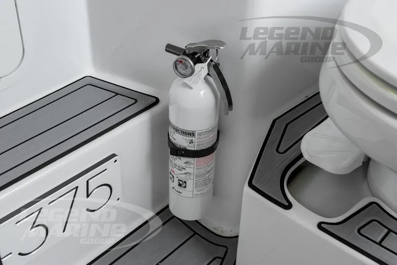 Slide: The Image of Interior view of 2023 Nor-Tech 390 Sport Center Console boat cabin. - 84