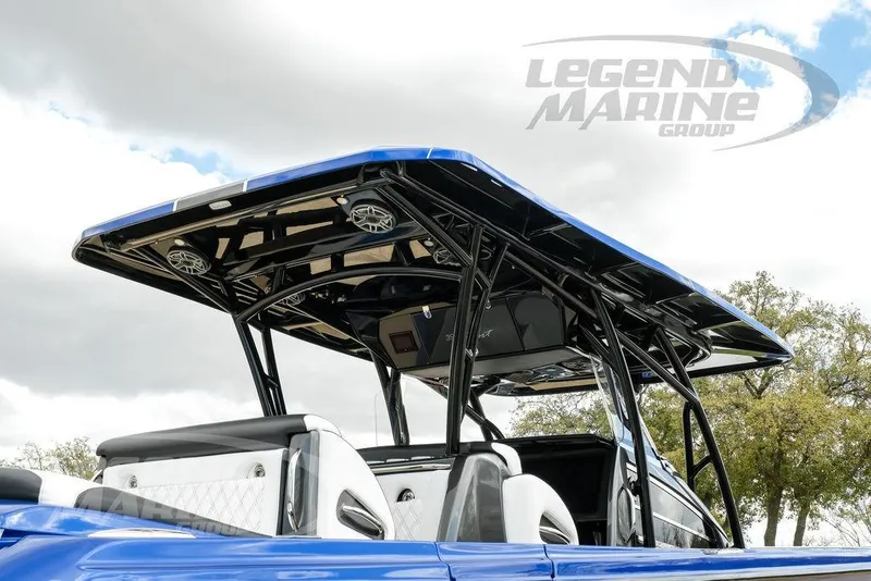 Slide: The Image of 2023 Nor-Tech 390 Sport Center Console interior detail with logo and Legend Marine Group branding. - 86