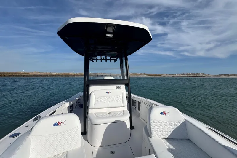 Slide: The Image of 2025 Crevalle 24 HCO boat on water, featuring sleek design and comfortable seating. - 15