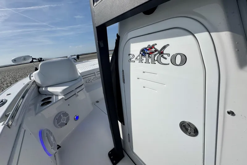 Slide: The Image of 2025 Crevalle 24 HCO boat interior with seating and storage compartment. - 20