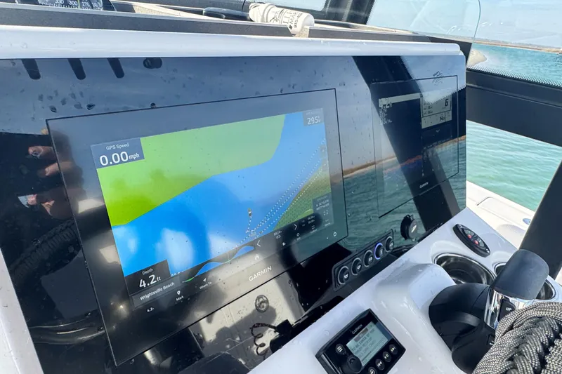 Slide: The Image of Dashboard of 2025 Crevalle 24 HCO boat with Garmin navigation display. - 25
