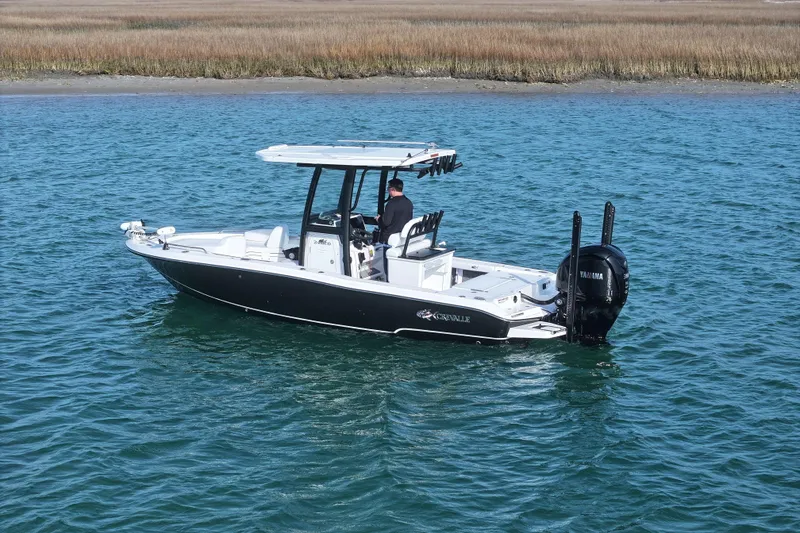 Slide: The Image of 2025 Crevalle 24 HCO boat on water, featuring sleek design and Yamaha engine. - 3