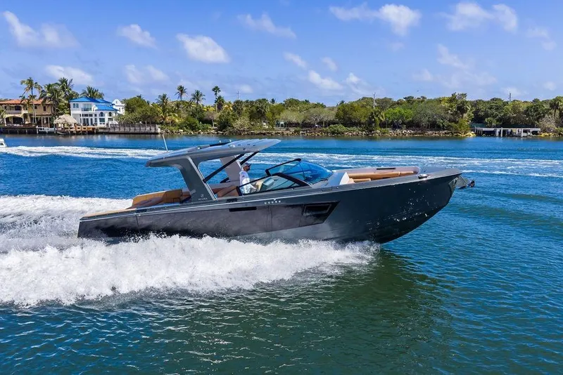 The Image of 2022 Aviara AV40 OB luxury boat cruising on a sunny day in scenic waters. - 0