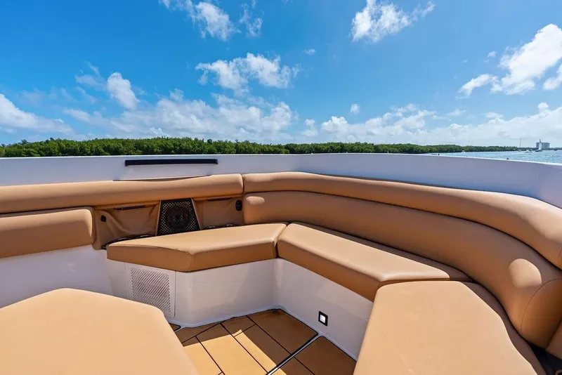 Slide: The Image of Luxurious seating on 2022 Aviara AV40 OB boat under clear blue sky. - 15