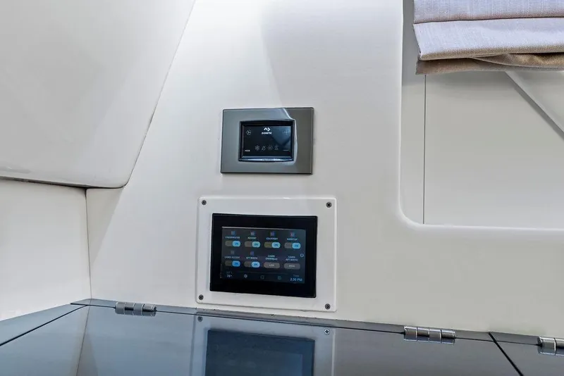 Slide: The Image of 2022 Aviara AV40 OB interior control panels with modern touchscreen displays. - 22