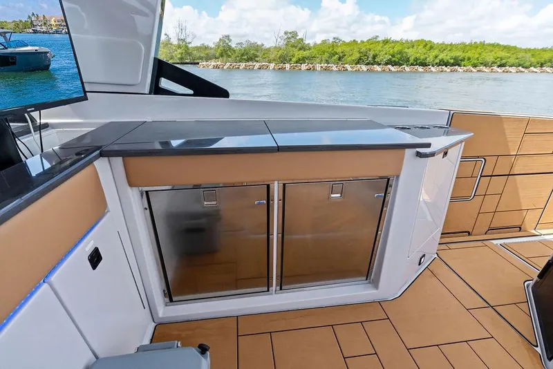 Slide: The Image of Luxury interior of 2022 Aviara AV40 OB boat with sleek cabinetry and scenic water view. - 26