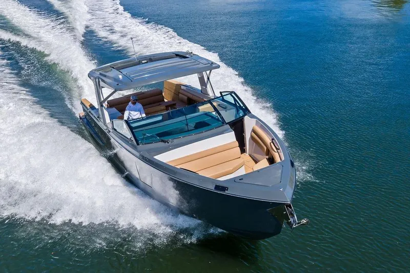 Slide: The Image of 2022 Aviara AV40 OB luxury boat cruising on a clear blue lake. - 3