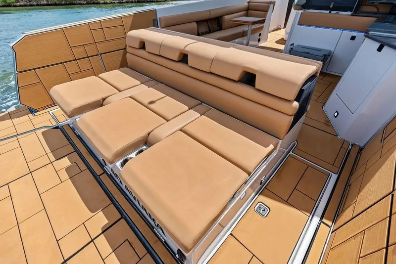 Slide: The Image of Luxurious seating on 2022 Aviara AV40 OB boat with tan upholstery and sleek design. - 32
