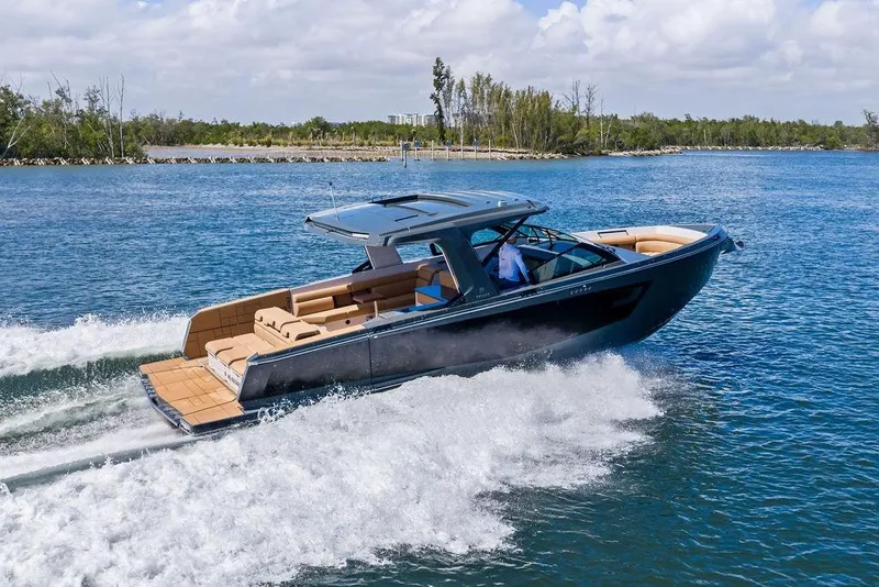 Slide: The Image of 2022 Aviara AV40 OB luxury boat cruising on a scenic waterway. - 4