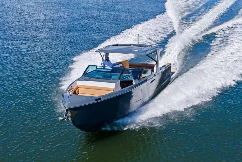 Slide: The Image of 2022 Aviara AV40 OB luxury boat cruising on open water. - 8