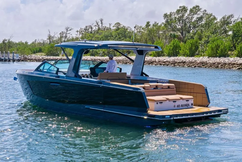 Slide: The Image of 2022 Aviara AV40 OB luxury boat cruising on a sunny day. - 10