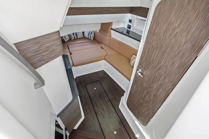 Slide: The Image of 2022 Aviara AV40 OB cabin interior with modern seating and wood accents. - 18