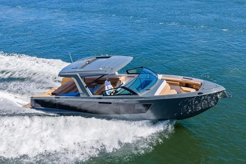 Slide: The Image of 2022 Aviara AV40 OB luxury boat cruising on open water. - 2