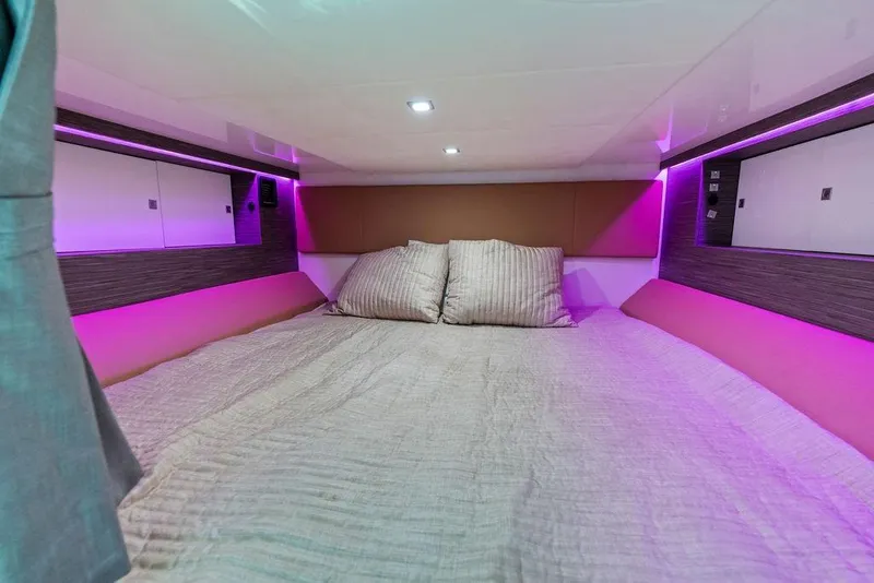 Slide: The Image of Luxurious cabin interior of 2022 Aviara AV40 OB with ambient purple lighting. - 21