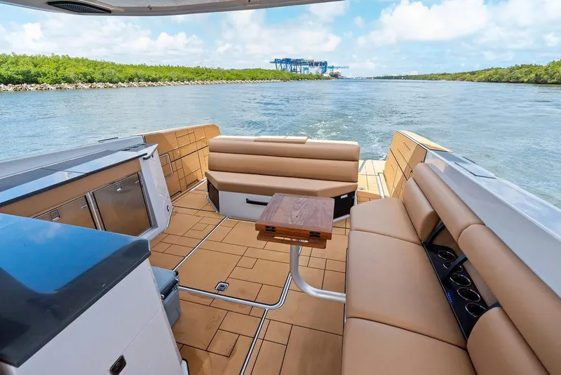 Slide: The Image of Luxurious 2022 Aviara AV40 OB boat interior with tan seating and scenic water view. - 25