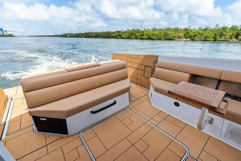 Slide: The Image of Luxurious 2022 Aviara AV40 OB boat interior with tan seating and scenic water view. - 29
