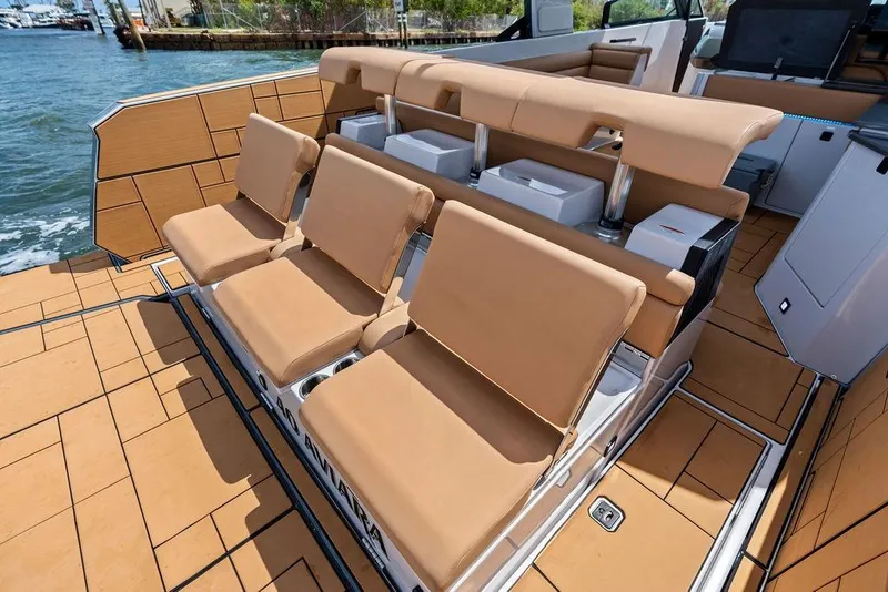 Slide: The Image of Luxury seating on 2022 Aviara AV40 OB boat, featuring tan upholstery and sleek design. - 33