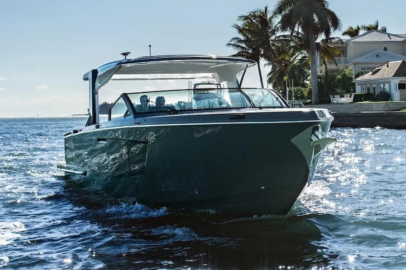 Slide: The Image of Manufacturer Provided Image: 2022 Aviara AV40 OB luxury boat cruising near waterfront homes. - 46